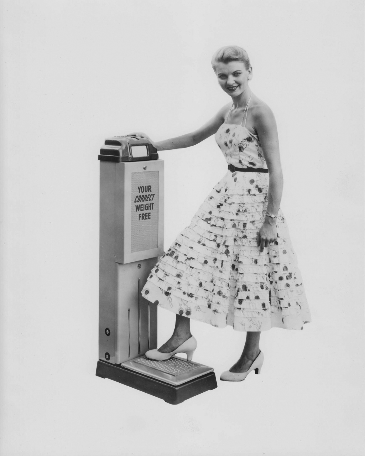 Old advertising image of a woman standing on a scale