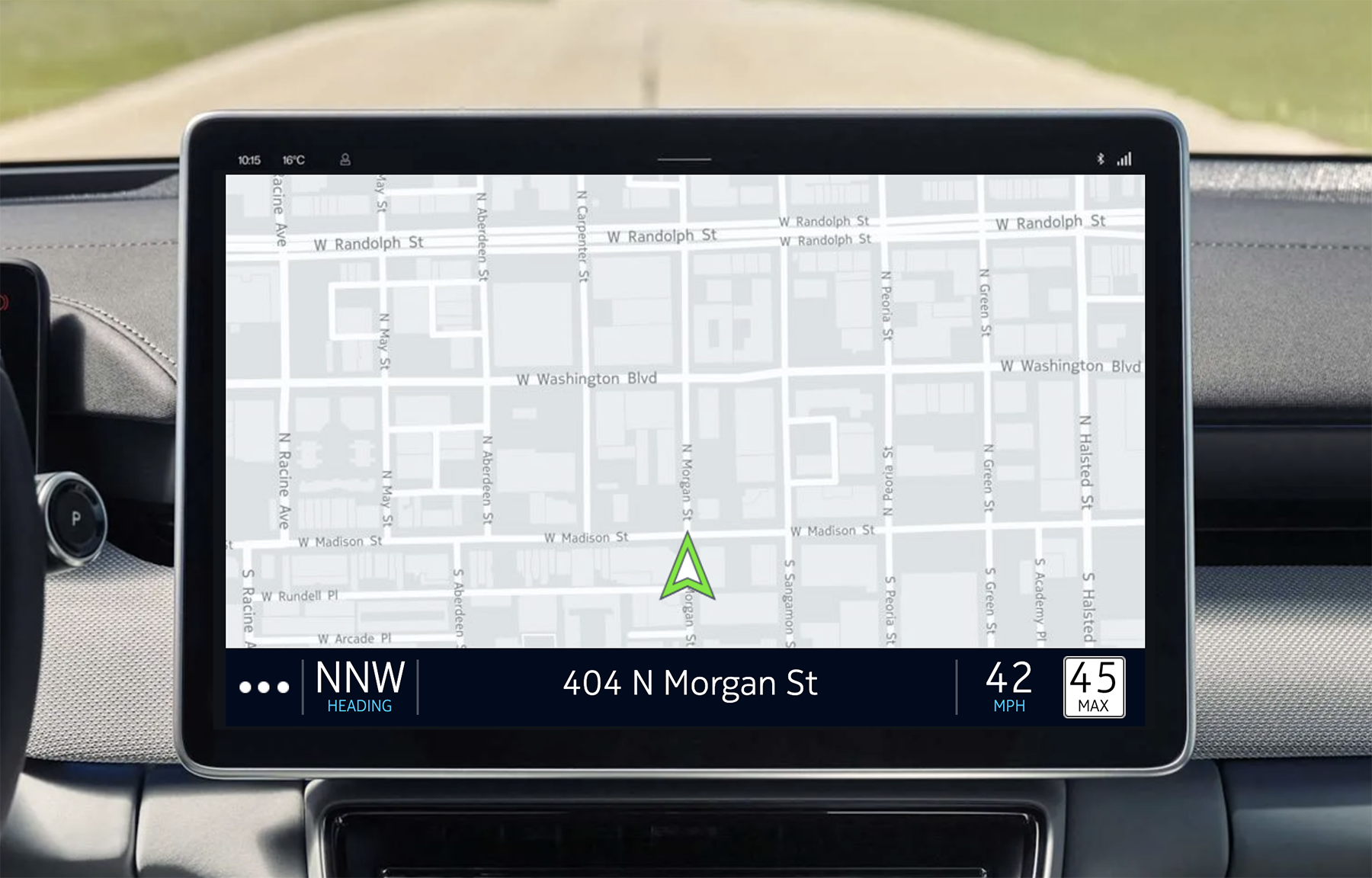 Vehicle infotainment GPS display showing a map, position indicator, speed, and direction.